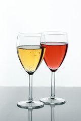 Two filled glasses on white