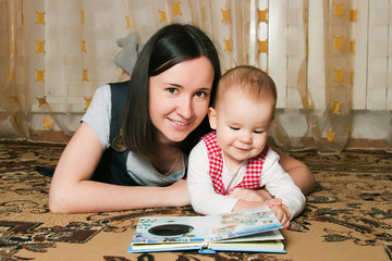Mother reading to daughter