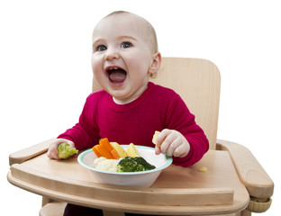 young child eating in high chair
