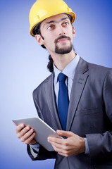 Construction worker working on tablet