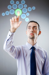 Businessman pressing virtual buttons