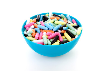 Bowl with colorful laces rods candy
