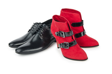 Male and female shoes on white
