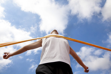Winning runner with cloud background