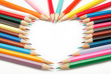 colored pencils crayons composed in the form of heart
