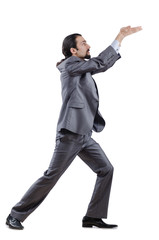 Businessman pushing away virtual obstacles