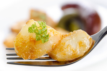 golden brown fried potatoes with parsley
