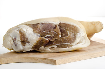 Raw knuckle of pork on a wooden board