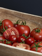 Red Tomatoes In Wooden Bowl