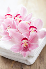 Fototapeta na wymiar orchid flowers and towels for spa