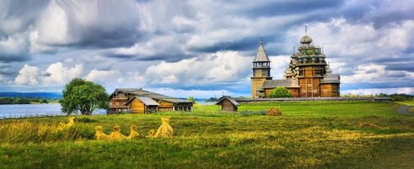 The wooden buildings of the ancient Russian architecture - obrazy, fototapety, plakaty