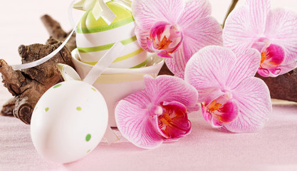 Obraz na płótnie Canvas Easter eggs and orchid flowers