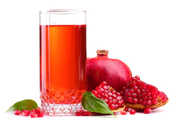 ripe pomergranate and glass of juice isolated on white.