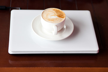 coffee on laptop