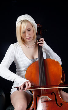 blond girl playing the chello