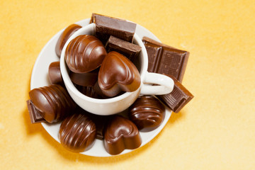 Cup full with chocolate candies