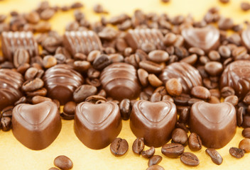 Heart shaped chocolate candies and coffee beans