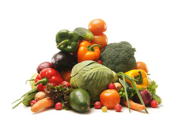 A pile of fresh and tasty fruits and vegetables on white