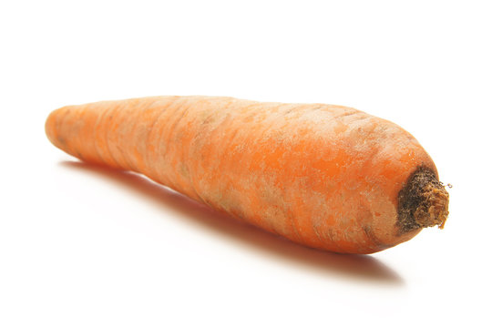 A fresh and tasty orange carrot on a white background