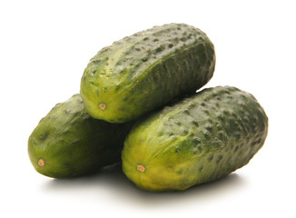 Fresh green cucumbers isolated on a white background