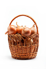 Fresh bulbs of onion in basket on a white background