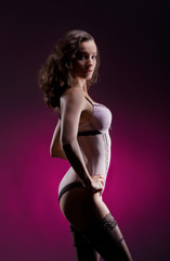 Fototapeta na wymiar Fashion shoot of a young woman in erotic lingerie
