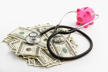 Piggy bank using stethoscope and dollar