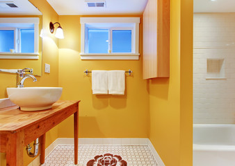 Orange bathroom with modern sink.