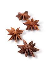 Several anise stars isolated on white background