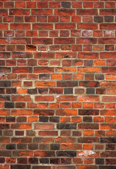 Colorful old English red brick wall background.