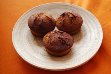Homemade muffins with hazelnuts, orange peel and raisins