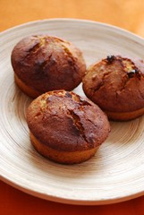 Homemade muffins with hazelnuts, orange peel and raisins