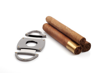 Cigars and a open cutter isolated on white background