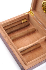 A part of opened humidor with cigars isolated on white backgroun