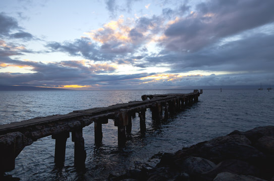 Delapidated old Lahaina wharf at sunset