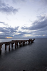 Fototapeta premium dipadated concrete pier during sunset at lahaina, maui