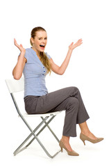Woman sitting on chair gesturing