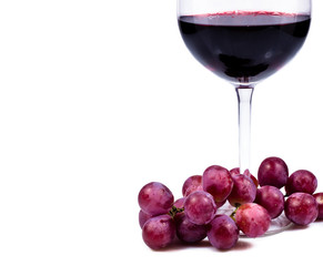 wine glass with red wine and grapes
