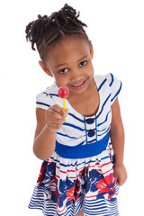 Portrait of a cute little african american girl with a lollipop