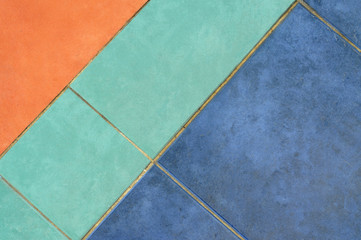 Pavement pattern in orange, blue and green