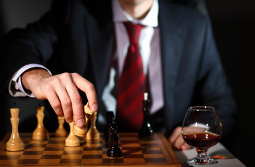 Businessman playing chess