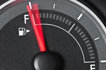 Naklejka premium Fuel gauge with motion blurred needle
