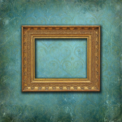 Classical gold frame on a grunge Victorian wallpaper
