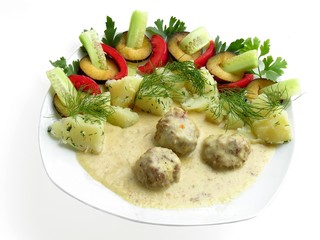 beef meat balls with sauce and vegetable salad
