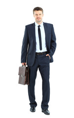 portrait of young business man holding briefcase in