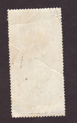 Old postage stamp border on black.