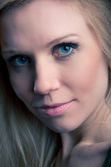 Close up portrait of young blond attractive woman.