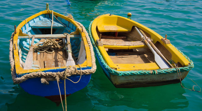 Two colorful boat in Marsaxlokk, Malta.