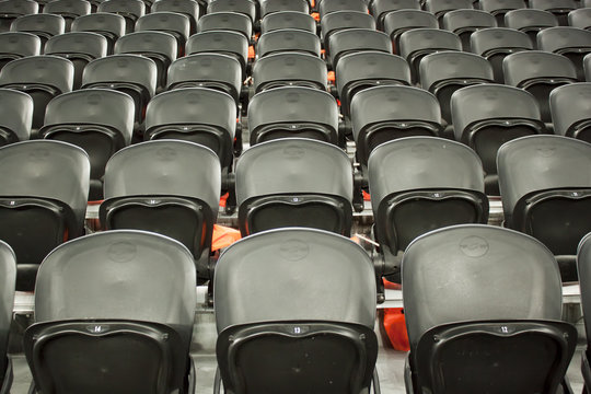 The empty black seats in the stadium