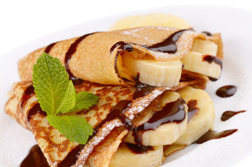 Crepes with chocolate syrup